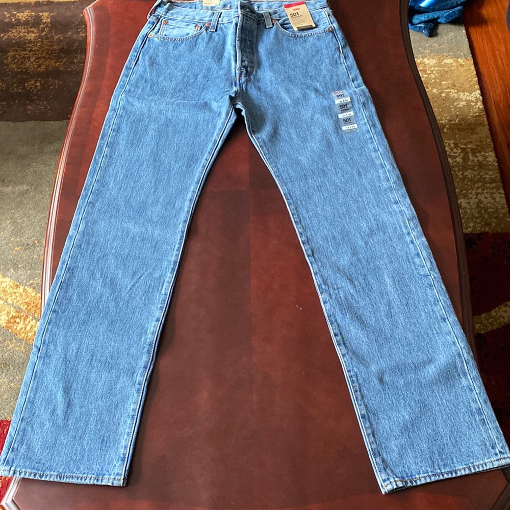 Levis 501 button fly blue jeans. Size 33x34. New with tags.